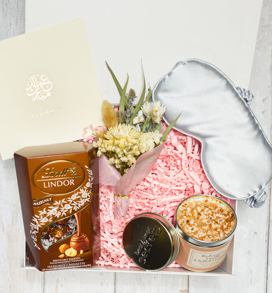 VelouraMist luxury Eid gift box with candle, chocolates, and sleep mask