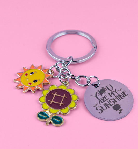 You Are My Sunshine" keyring with sunflower and sun design in stainless steel, spreading love and positivity.